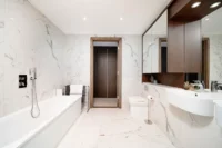 Modern 2-bedroom 2-bathroom flat with porter for sale in Prime central London