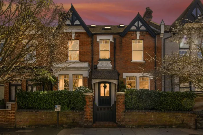 a Victorian brick house with a dusky sky in Crouch End London N8
